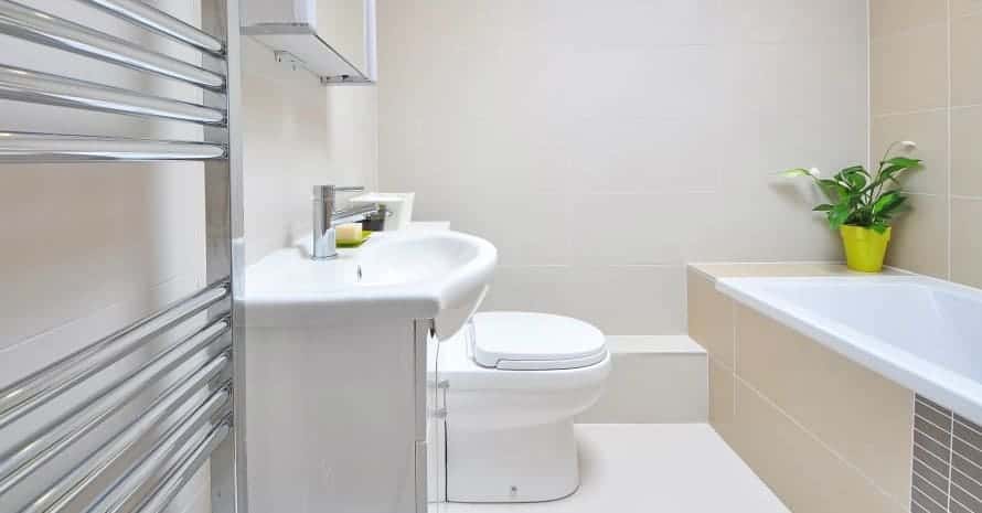 white ceramic toilet bowl and bathtub