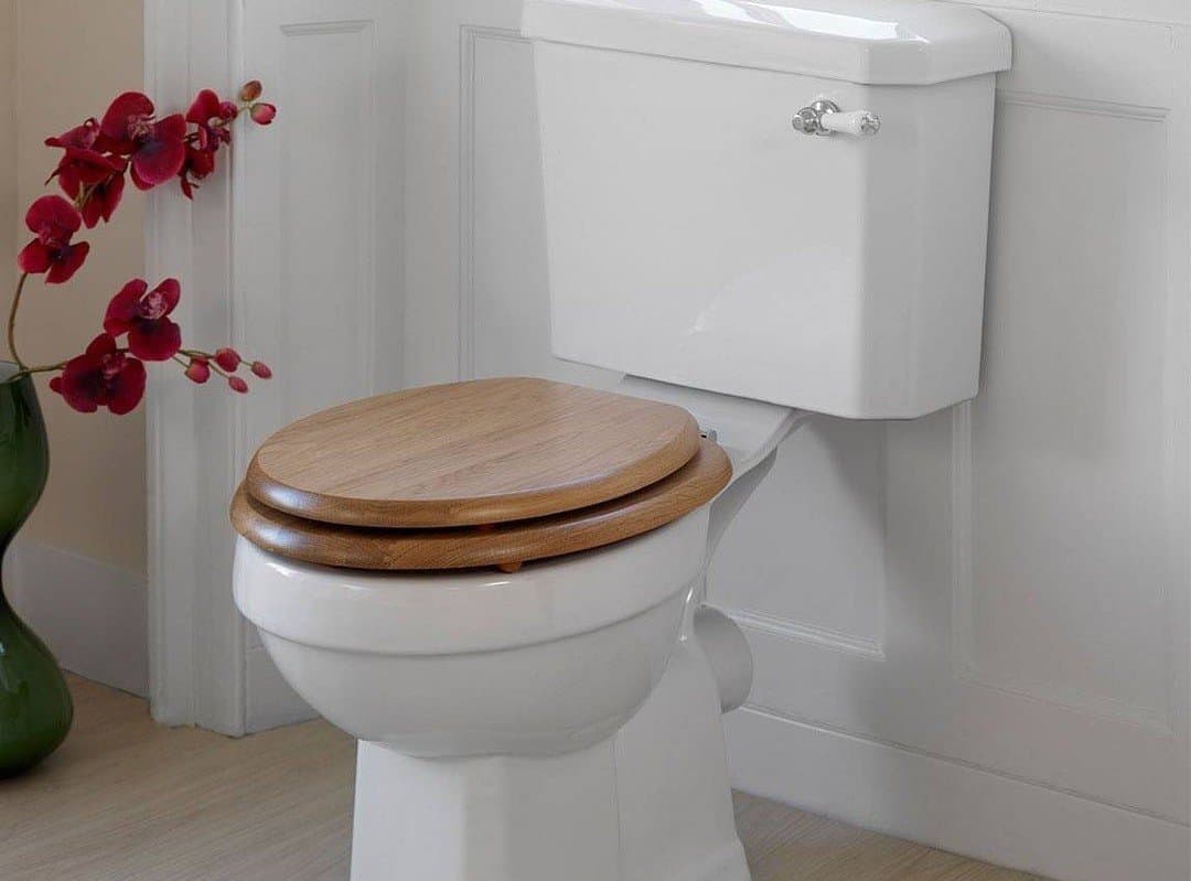 toilet with wooden seat