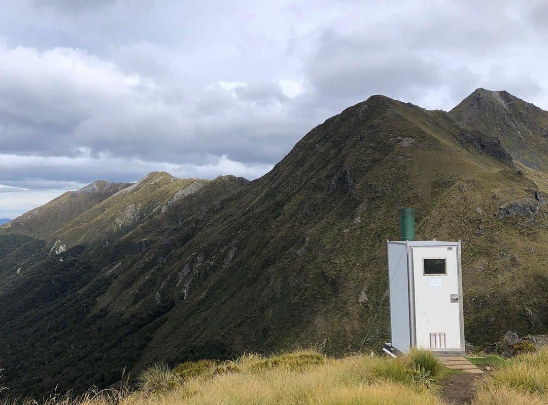 white toilet vault in the mountains